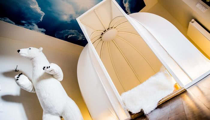 sleep in the igloo bed in the theme room in the Beverland Resort