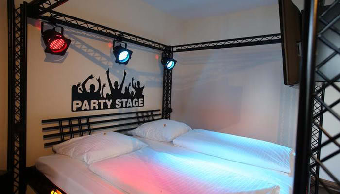 Disco bed with colorful party lighting.